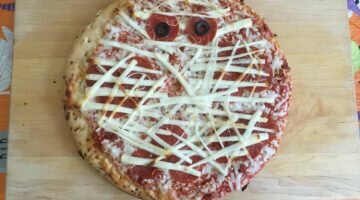 Mummy Pizza. Impress your kids by upgrading a frozen pizza into a mummy pizza!